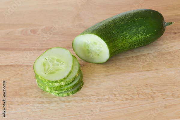 Obraz cucumber slices on wooden background