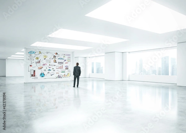 Fototapeta businessman standing in bright office