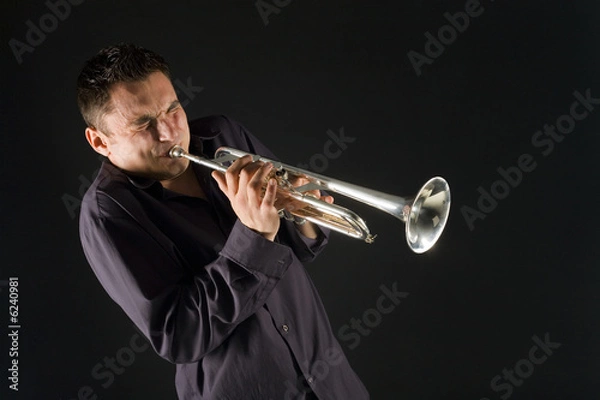 Fototapeta Man in shirt trumpet with might and main. Front view.
