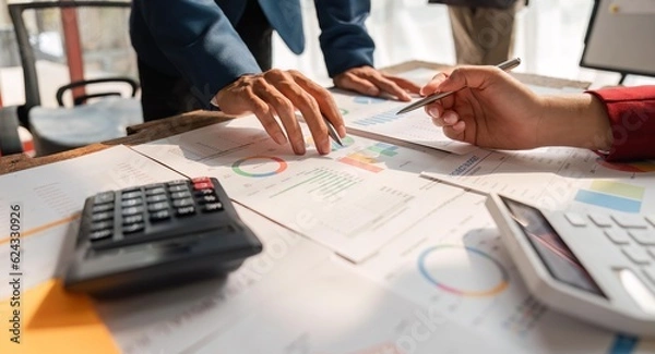 Fototapeta Business team analyzes financial business finance reports on laptop and graph documents during corporate meeting discussions showing successful teamwork, business meeting ideas