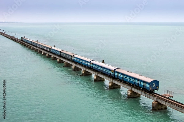 Fototapeta Rameshwaram to Tiruchirappalli passenger train crosses 2 kilometers long Pamban sea railway bridge, India.