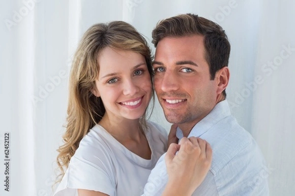Fototapeta Close-up portrait of a loving couple embracing