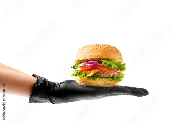Fototapeta A hand in a black glove holds a beef burger on a white background, a banner, an advertisement for a hamburger.