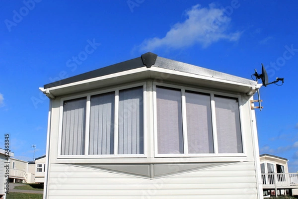 Obraz Caravan in trailer park with cloudscape