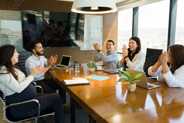 Fototapeta Group of businesspeople clapping hands after successful meeting