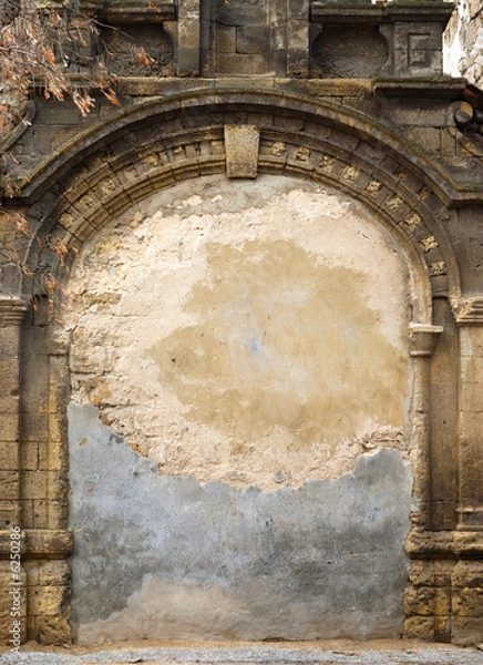 Obraz Ancient immured arch within old shell rock wall