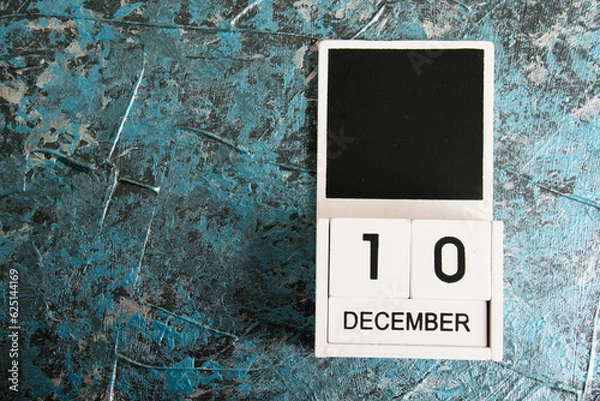Fototapeta Wooden calendar on a dark background. Human Rights Day.