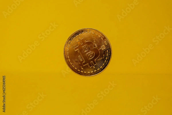 Fototapeta Bitcoin gold coin levitation with shadow reflection. Bitcoin flying mining trading concept. BTC golden money. Worldwide virtual internet Cryptocurrency or crypto digital payment system. Digital coin
