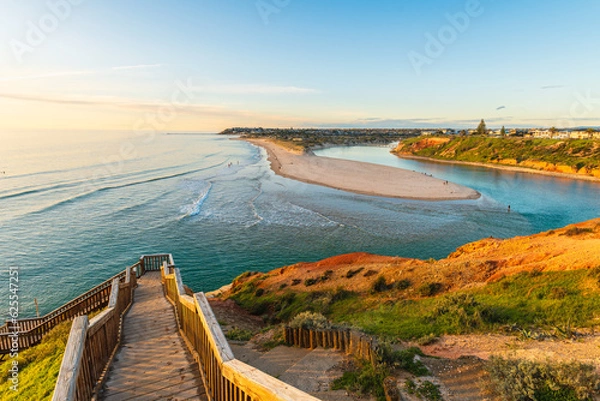 Obraz South Port beach boardwalk viewed towards Port Noarlunga through Onkaparinga River at sunset, South Australia