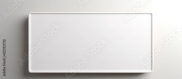 Fototapeta Photo of a minimalist white square object mounted on a wall with empty space for text or other creative elements with copy space