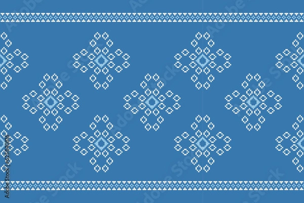 Fototapeta Ethnic geometric fabric pattern Cross Stitch.Ikat embroidery Ethnic oriental Pixel pattern navy blue background. Abstract,vector,illustration. Texture,clothing,frame,decoration,motifs,silk wallpaper.