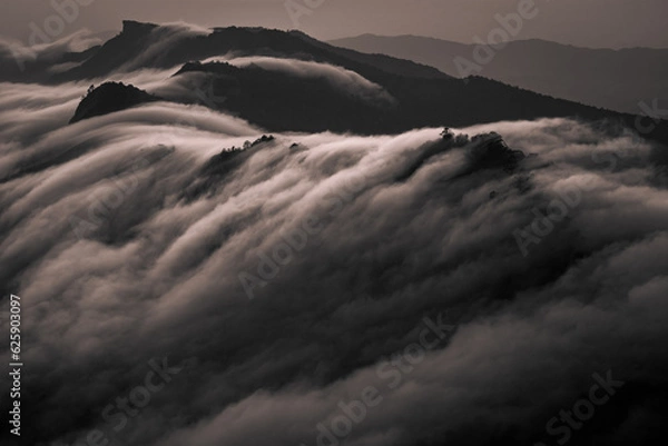 Fototapeta clouds moving across mountain range in the northern of thailand (Phu Chi Dao Chiang Rai Province)