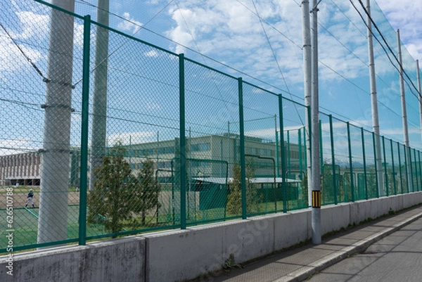 Obraz 学校の部活と高いフェンス