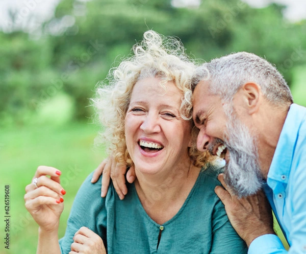 Fototapeta woman man couple happy together hug bonding mature mid middle age aged park outdoor talking leisure fun smiling love old nature wife happiness lifestyle people adult caucasian husband togetherness