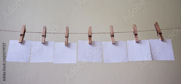 Obraz seven checkered note papers hanging on a clipboard