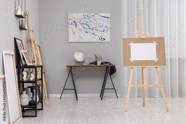 Fototapeta Artist's studio with easels, canvases and painting supplies