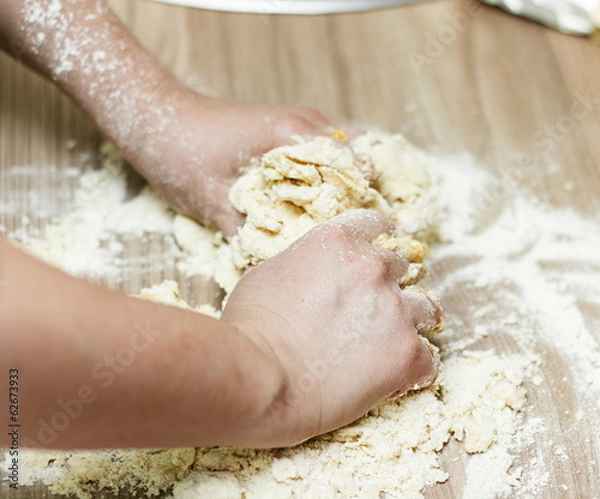 Fototapeta Kneading Dough on the Kitchen Table