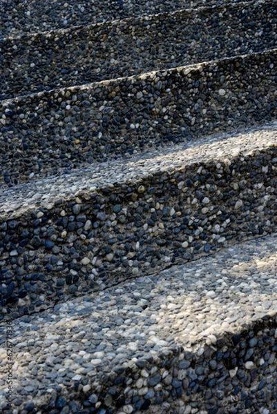 Fototapeta Outdoor garden stairs covered with textur epoxy pebble floor random color