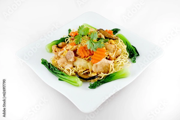 Fototapeta Pork Fried Noodle with carrot and Dwarf cabbage, evening street food in cambodia