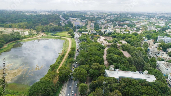 Obraz Bangalore, India 24th March 2022: An aerial shot of Bangalore city with live traffic and lake. The capital city of Karnataka drone view. The megacity of India. Cosmopolitan city. Indira nagar.
