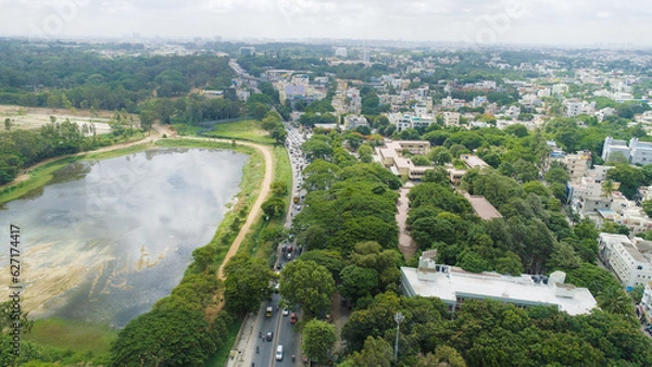 Obraz Bangalore, India 24th March 2022: An aerial shot of Bangalore city with live traffic and lake. The capital city of Karnataka drone view. The megacity of India. Cosmopolitan city. Indira nagar.