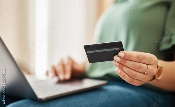 Fototapeta Laptop, credit card and woman hands with online shopping and banking at home. Ecommerce, cashback and sale with digital payment on web and easy pay with plastic discount and website checkout