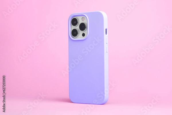 Obraz smart phone in purple case back side view isolated on pink background, iPhone 15 Pro case mock up