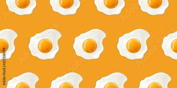 Fototapeta Fried eggs on a yellow background. Seamless pattern with scrambled eggs. Vector illustration of eggs. Realistic image.
