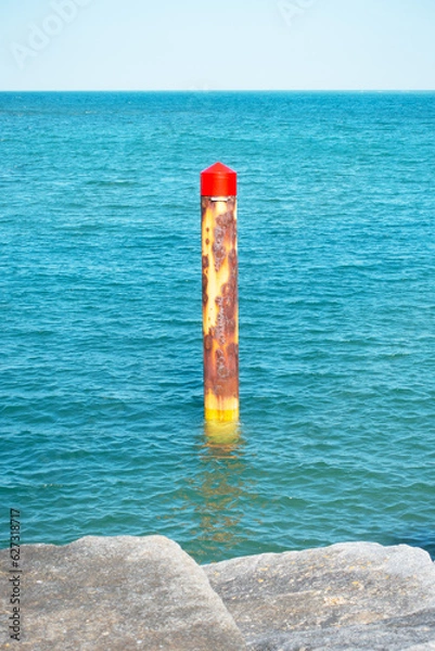 Fototapeta Marker post at the port