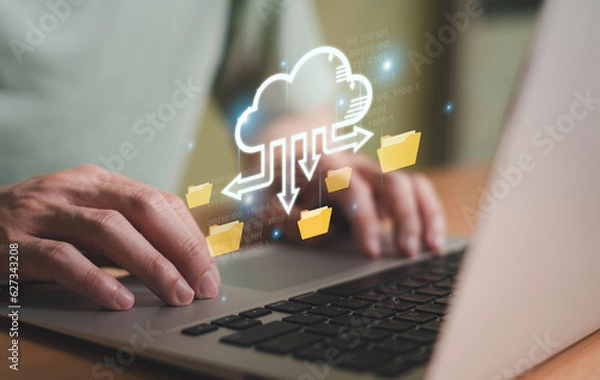 Fototapeta Business person migrate data and corporate information into cloud technology for data security and back up as disaster recovery site and prevent for cyber crime. Data inventory for enterprise.
