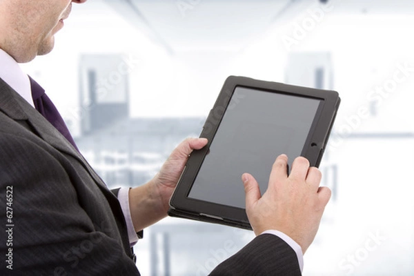 Obraz Businessman using touch pad, close up shot