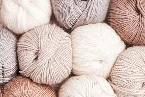 Obraz Craft knitting hobby background with yarn in natural colors. Recomforting hobby to reduce stress for cold fall and winter weather.