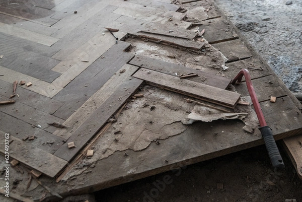 Fototapeta A closeup of an old broken dismantled parquet floor