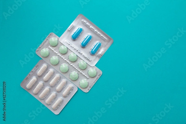 Fototapeta Mental health food supplements and vitamins. Pills top view with copy space.