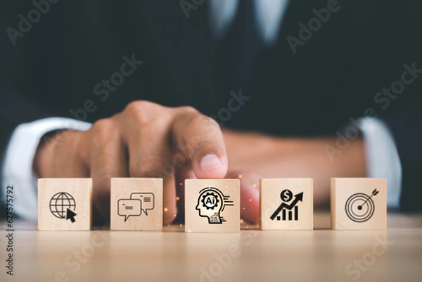 Fototapeta Ai technology, Artificial Intelligence. Businessman hand holding wooden cube with Ai icon, Artificial Intelligence to help solve work problems and improve the efficiency of work. Futuristic technology