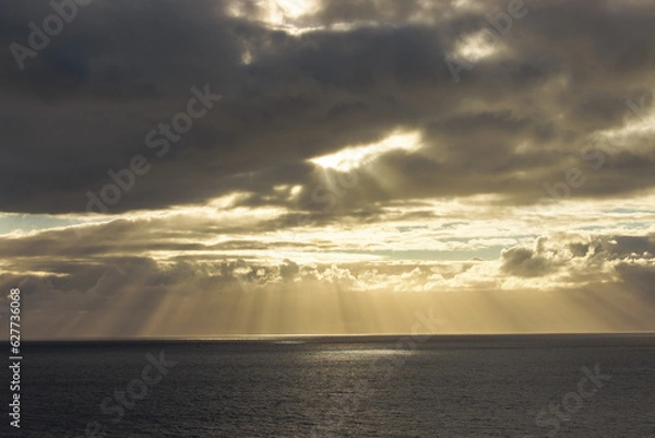 Obraz sunset over the sea with light rays