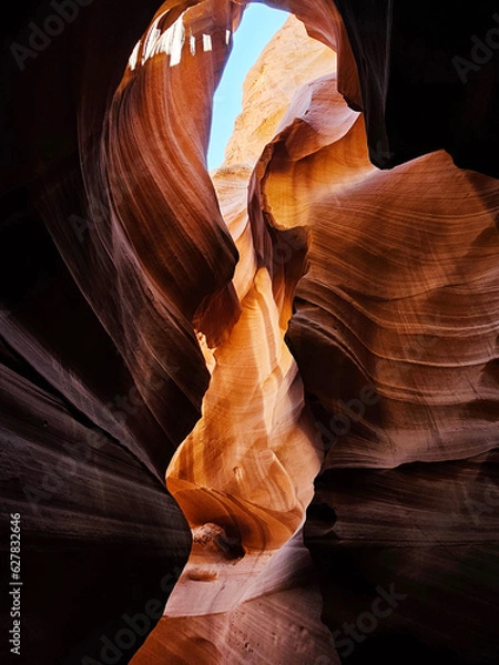 Fototapeta photo of antelope canyon on the navajo reservation. warm light filtering through the rocks, creating beautiful orange, red and yellow colors. Signs of rock erosion caused by water and wind