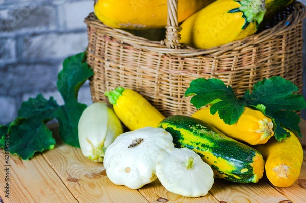 Fototapeta fresh zucchini and squash in a wicker basket