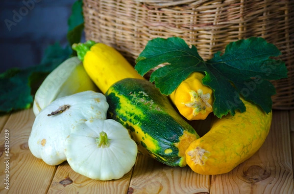 Fototapeta fresh zucchini and squash in a wicker basket