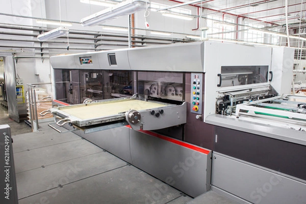 Fototapeta The equipment for a press. Offset machine at the printing manufacturing. Printing machine