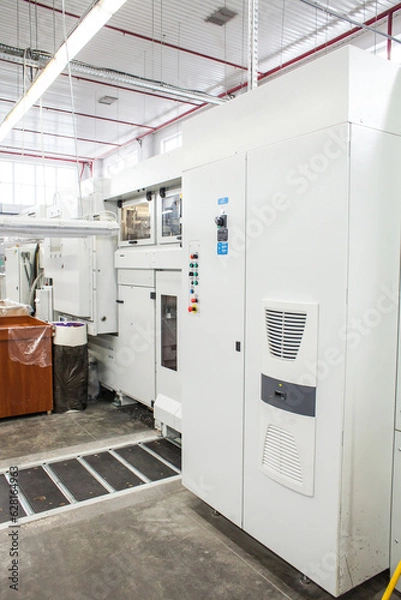 Fototapeta The equipment for a press. Offset machine at the printing manufacturing. Printing machine