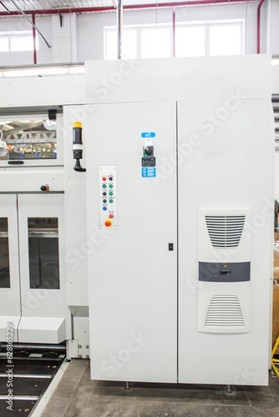 Fototapeta The equipment for a press. Offset machine at the printing manufacturing. Printing machine