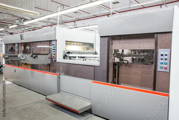 Fototapeta The equipment for a press. Offset machine at the printing manufacturing. Printing machine