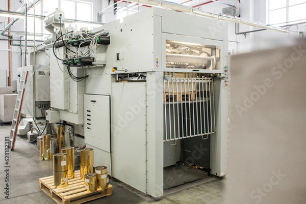 Fototapeta The equipment for a press. Offset machine at the printing manufacturing. Printing machine