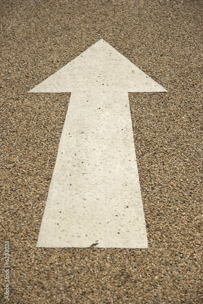 Fototapeta Arrow painted in a road surface