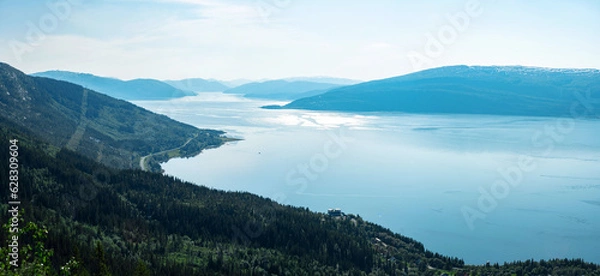 Fototapeta Panorama over Ranfjorden going west from Hauknestinden, 800 m altitude. Peak of Hauknes, Mo i Rana. Mountains dramatically going down into the fjord water below. Clear skies during Norwegian summer.	