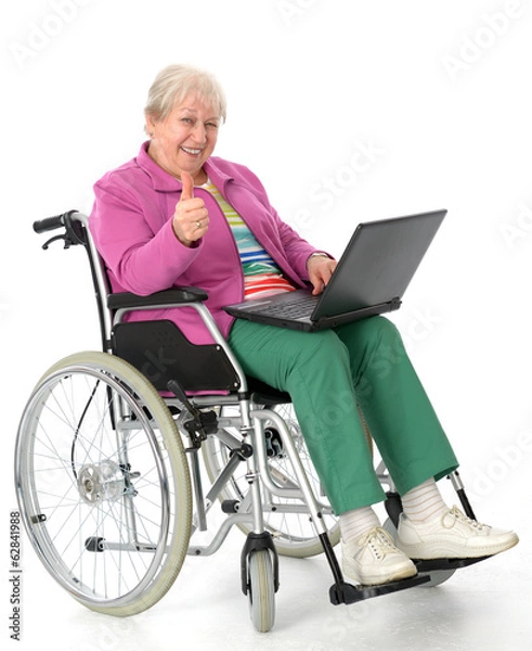 Obraz female senior in wheelchair using a computer