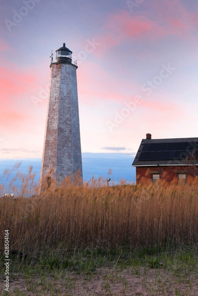 Obraz Beautiful sunset of New Haven Light House, Connecticut, USA. The lighthouse is dark, but the tower remains, greeting ships from around the world to New Haven. 