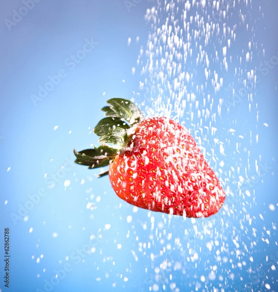 Fototapeta red strawberry sprinkled with white sugar