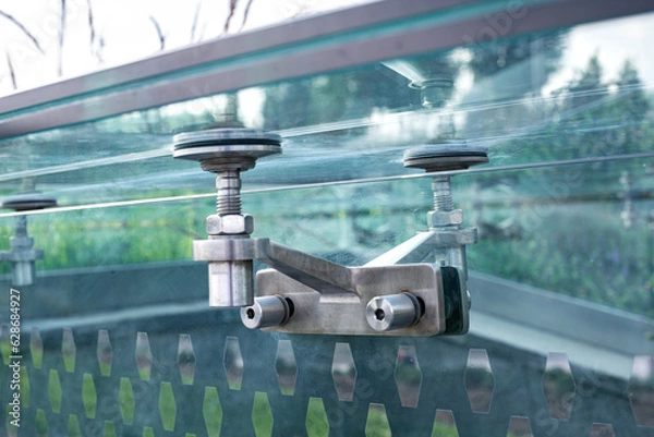 Obraz glass pergola steel roof mounts bolted fixed to transparent wall, modern architecture framless close-up, nobody.